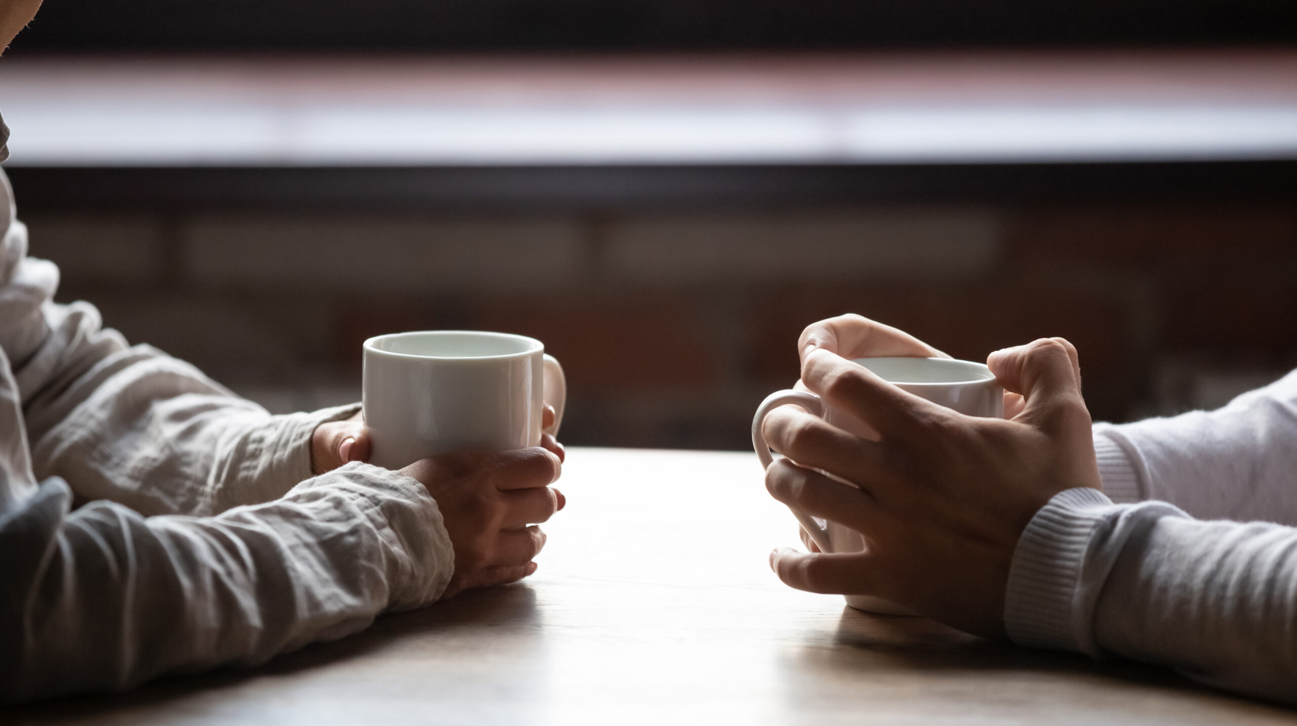 Hands holding coffee